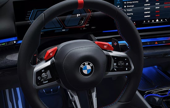 Close-up view of BMW M5 Touring steering wheel. | BMW of Portland in Portland OR