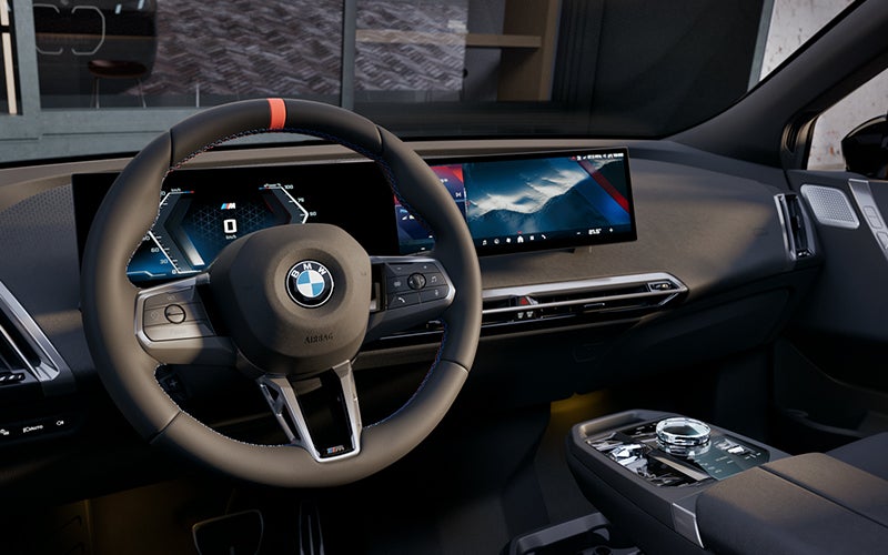 Interior steering wheel and dashboard of the BMW iX M70. | BMW of Portland in Portland OR